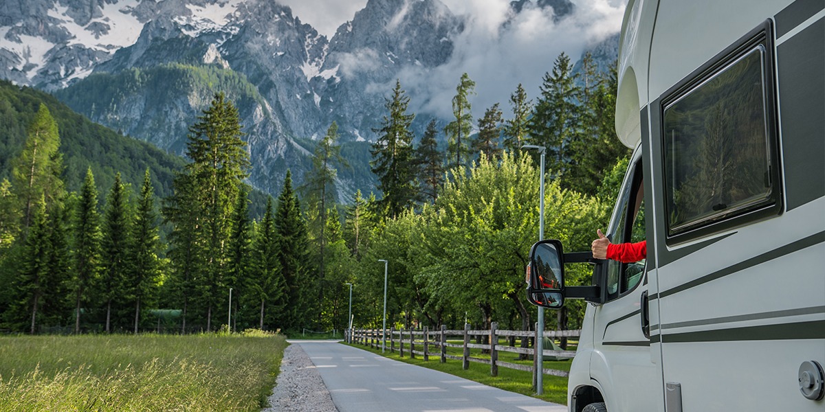 A parked RV during spring travel, demonstrating the importance of security and tracking features.