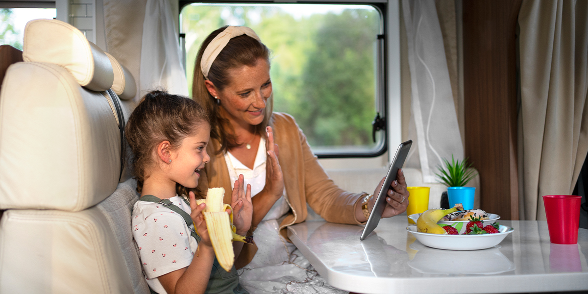 Kids and adults in an RV watching movies and listening to music streamed from a local media server.